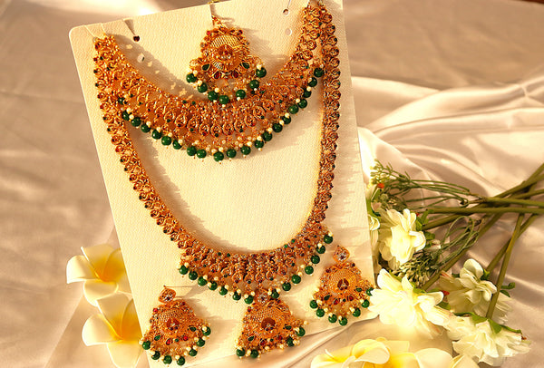 Nitya Jewels Green Stone Studded Gold-Plated Handcrafted Traditional Temple Jewellery Set,  Antique Necklace Set with earring & Maang Tikka Set For Women